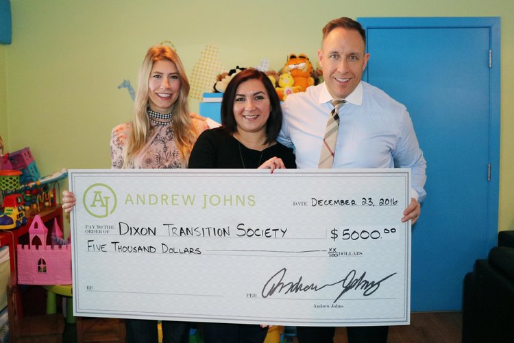 Crystal Johns, Pany Aghili, and Andrew Johns (the host of Coastal Front podcast) holding a $5,000 cheque for Dixon Transition Society