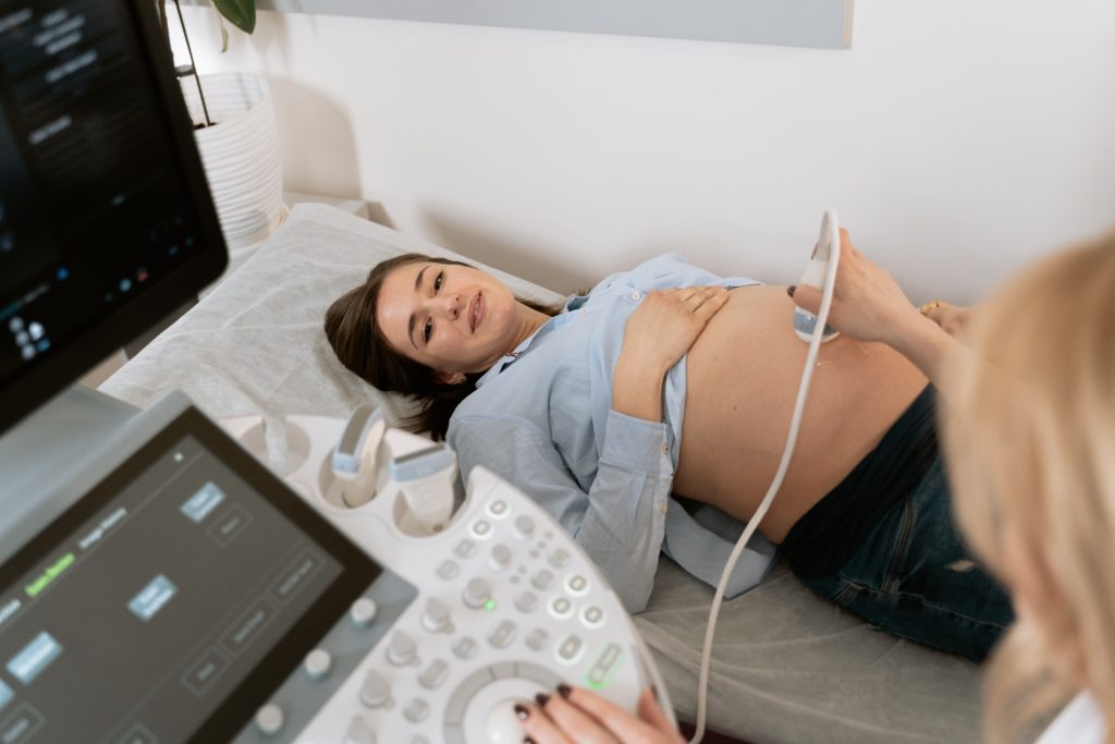 A woman receives an ultrasound